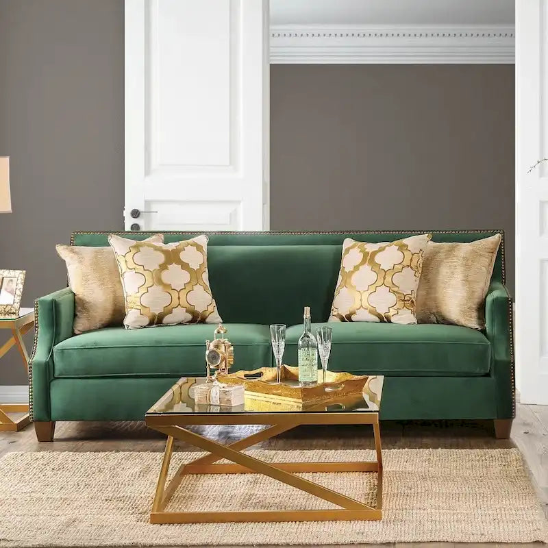 Divano imbottito in tessuto verde di transizione con borchie decorative
