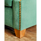 Divano imbottito in tessuto verde di transizione con borchie decorative